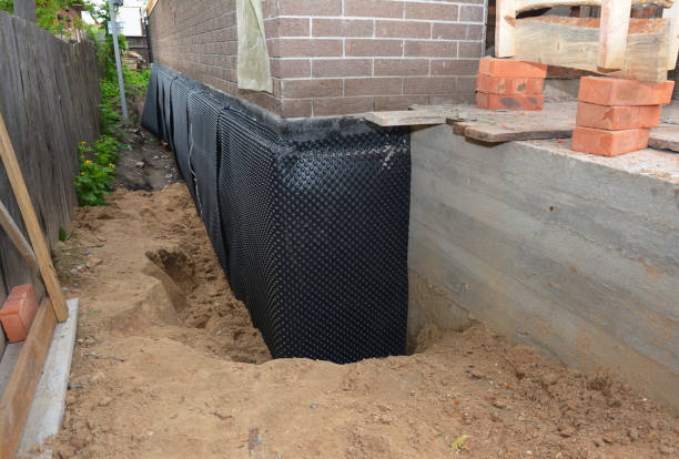 SJ Waterproofing Pros technician performing targeted Waterproofing assessment in Holton, IN